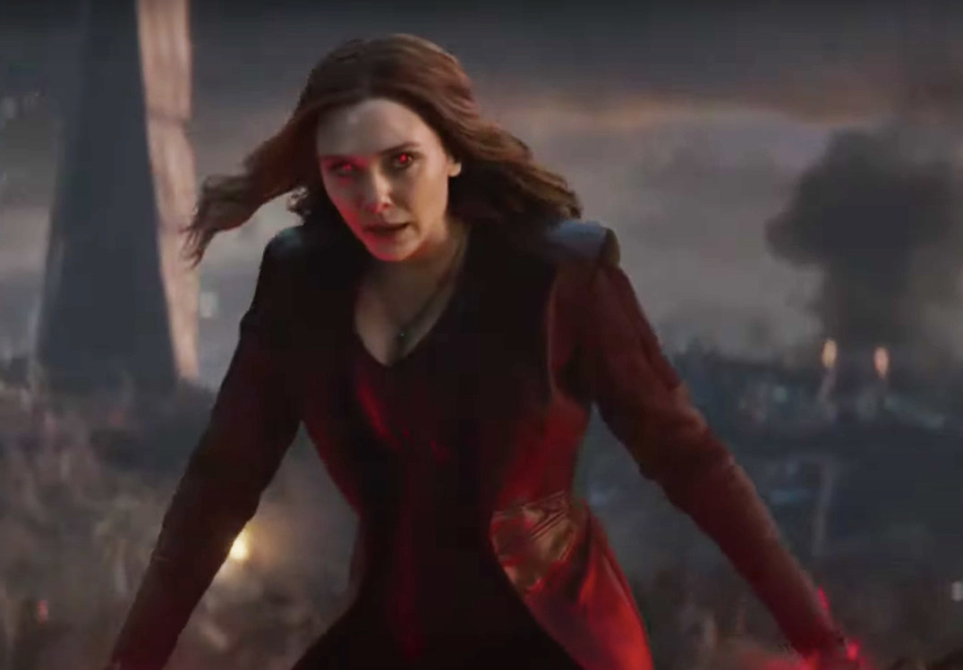 Wanda in her original costume, which features a low-cut shirt with a jacket over it