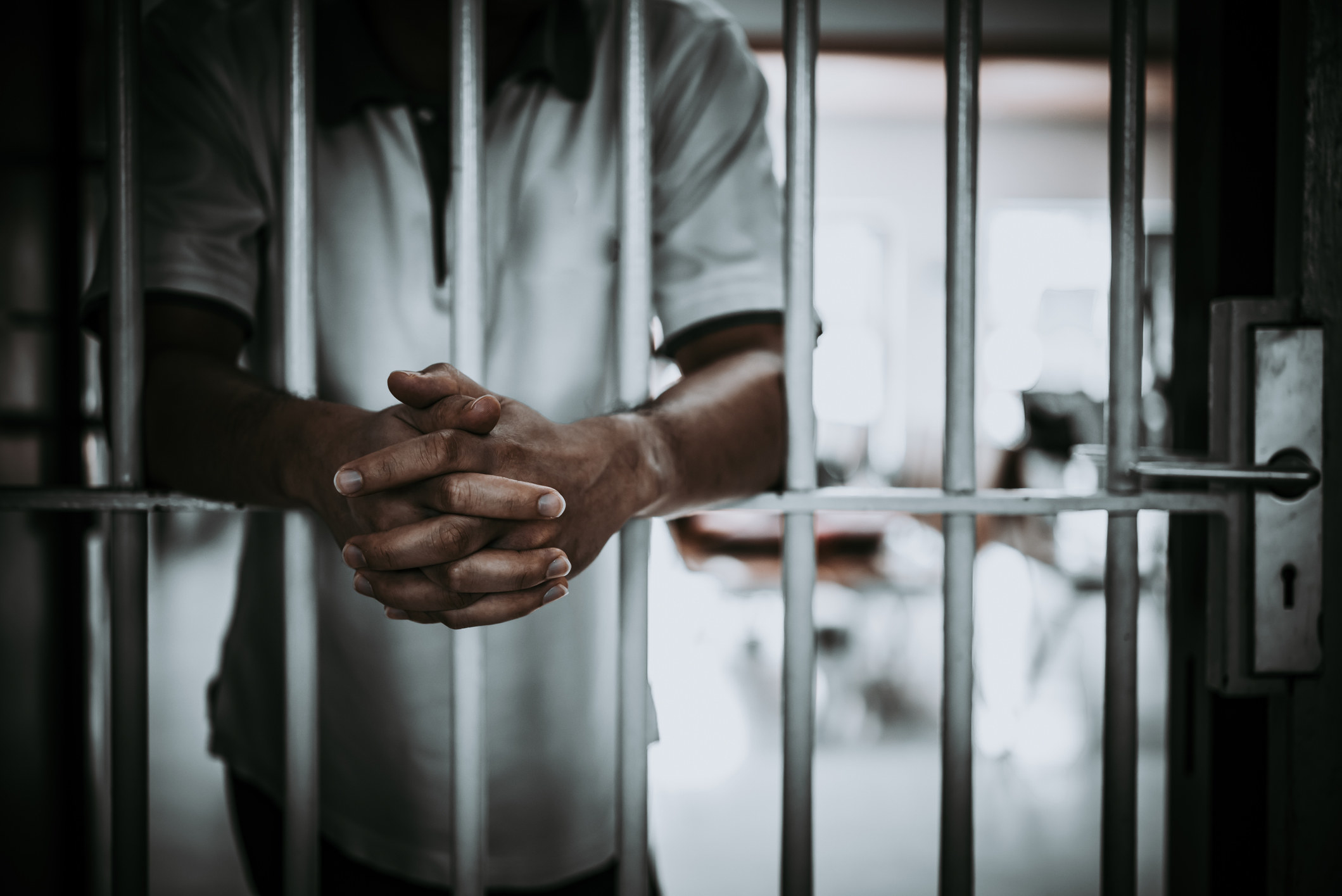 a person in a jail cell