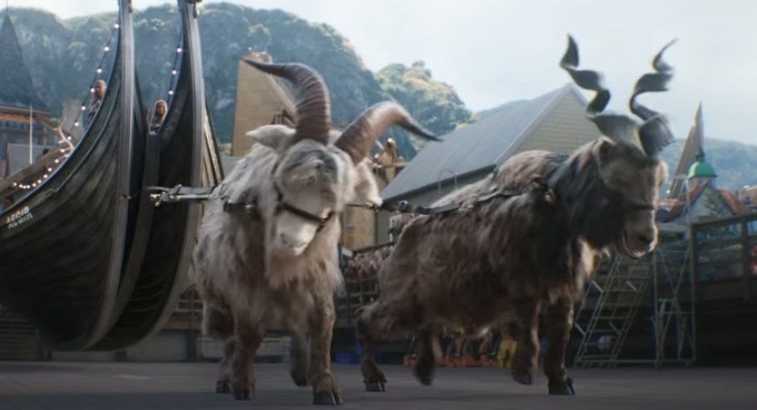 Toothgnasher and Toothgrinder about to fly away with Thor and Jane in the back of the boat sized chariot