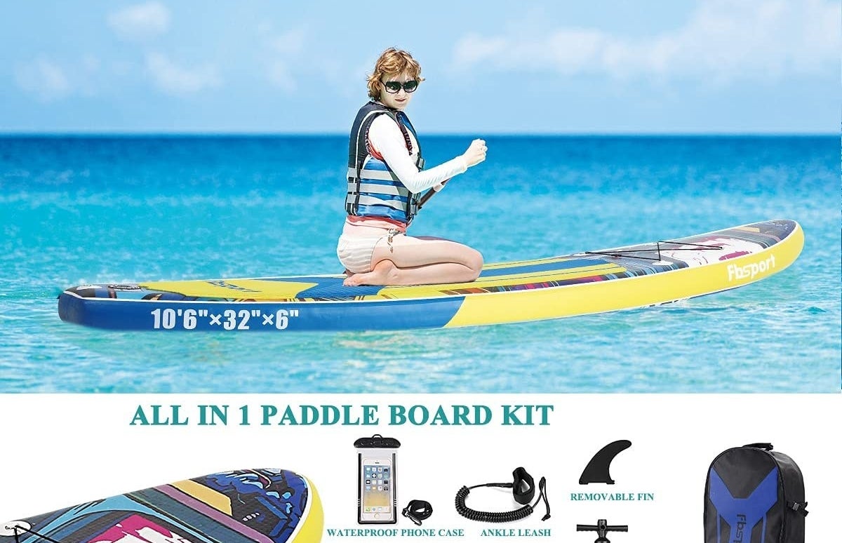 A person kneeling on their board on the water