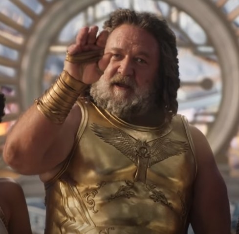 Russell Crowe as Zeus about to flick away Thors disguise