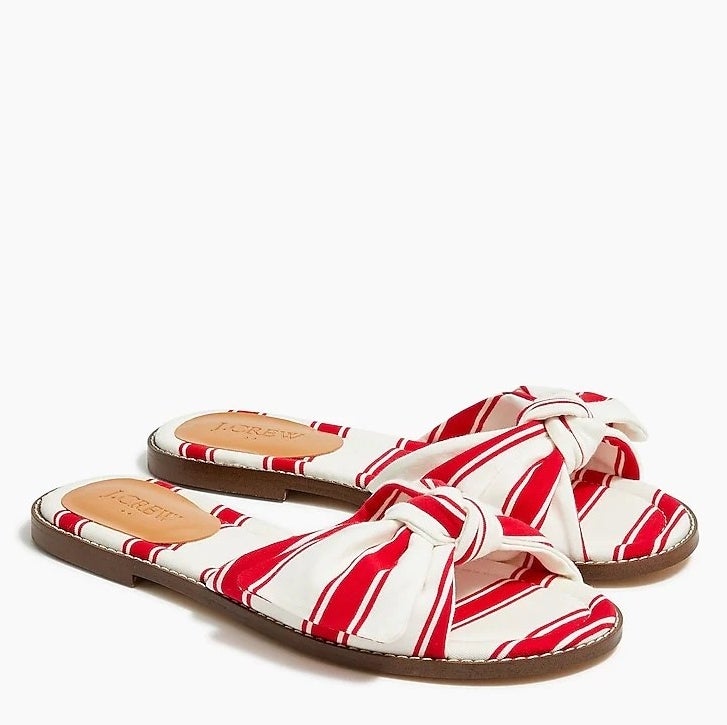 a pair of red and white striped sandals