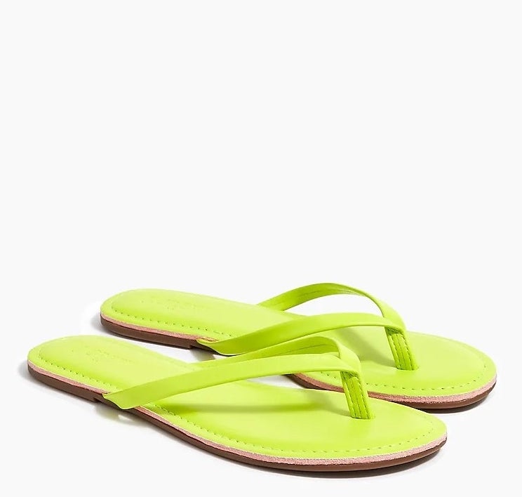 a pair of neon green flip-flops