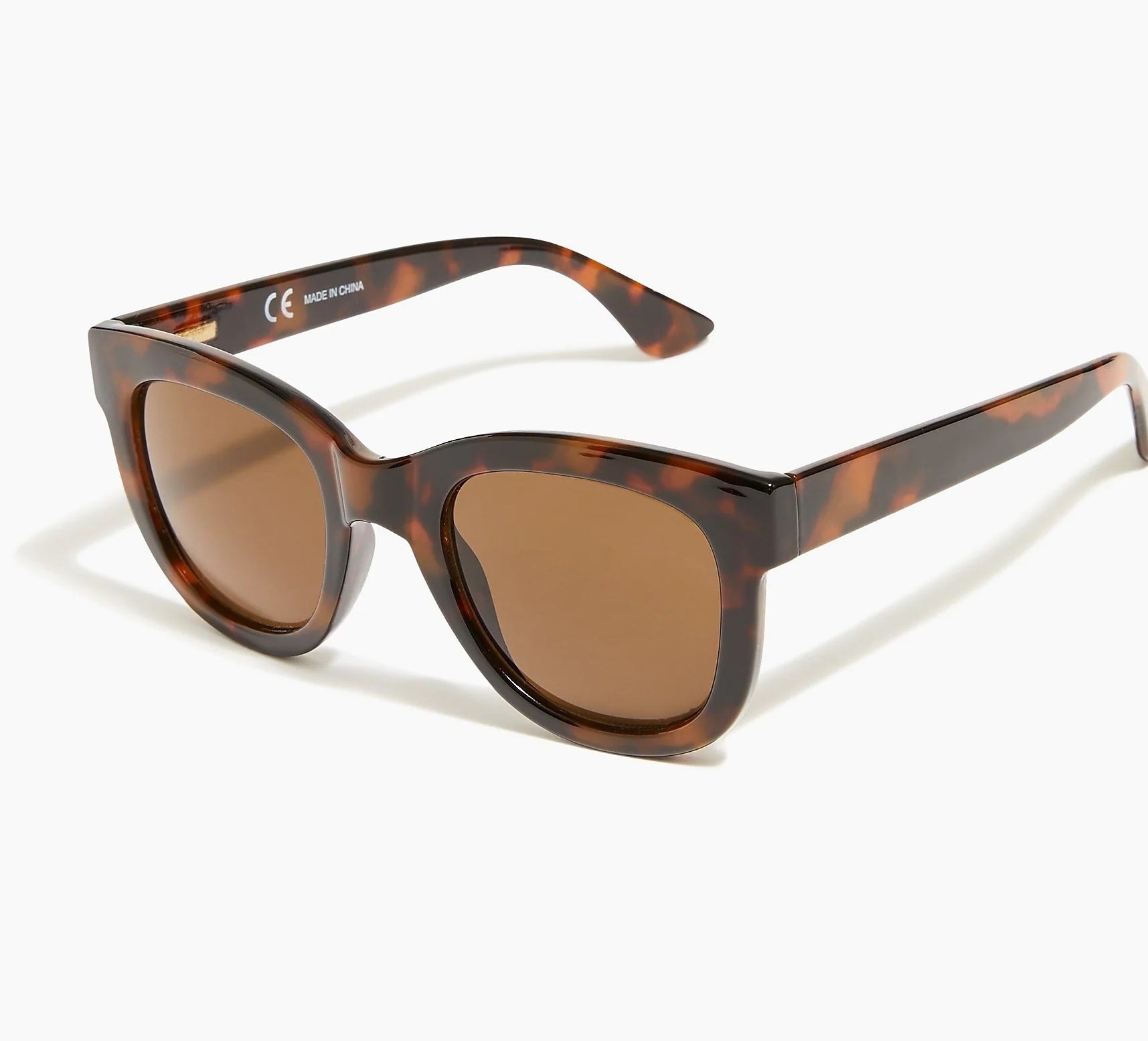 a pair of tortoise framed sunglasses