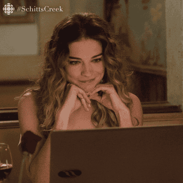 A gif of Alexis Rose from Schitt&#x27;s Creek booping her laptop screen