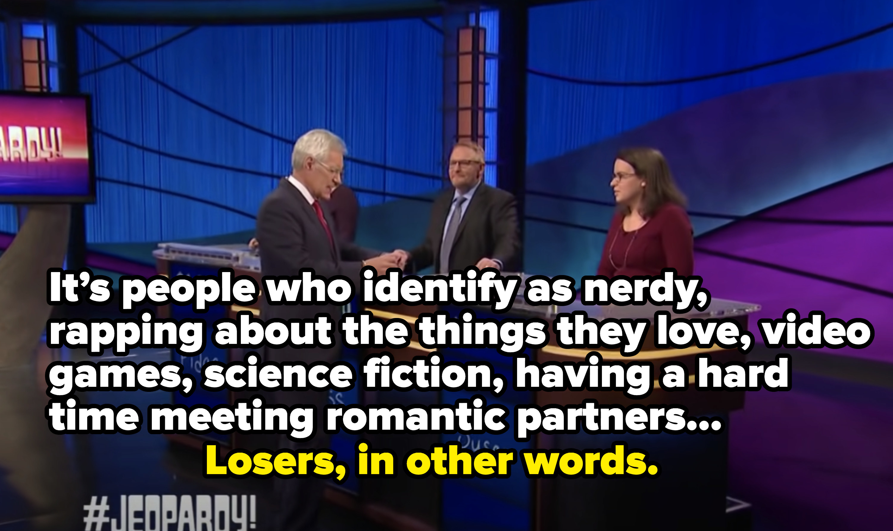 Woman saying &quot;It&#x27;s people who identify as nerdy, rapping about the things they love, video games, sci-fi, having a hard time meeting romantic partners&quot; and Alex says, &quot;Losers, in other words&quot;