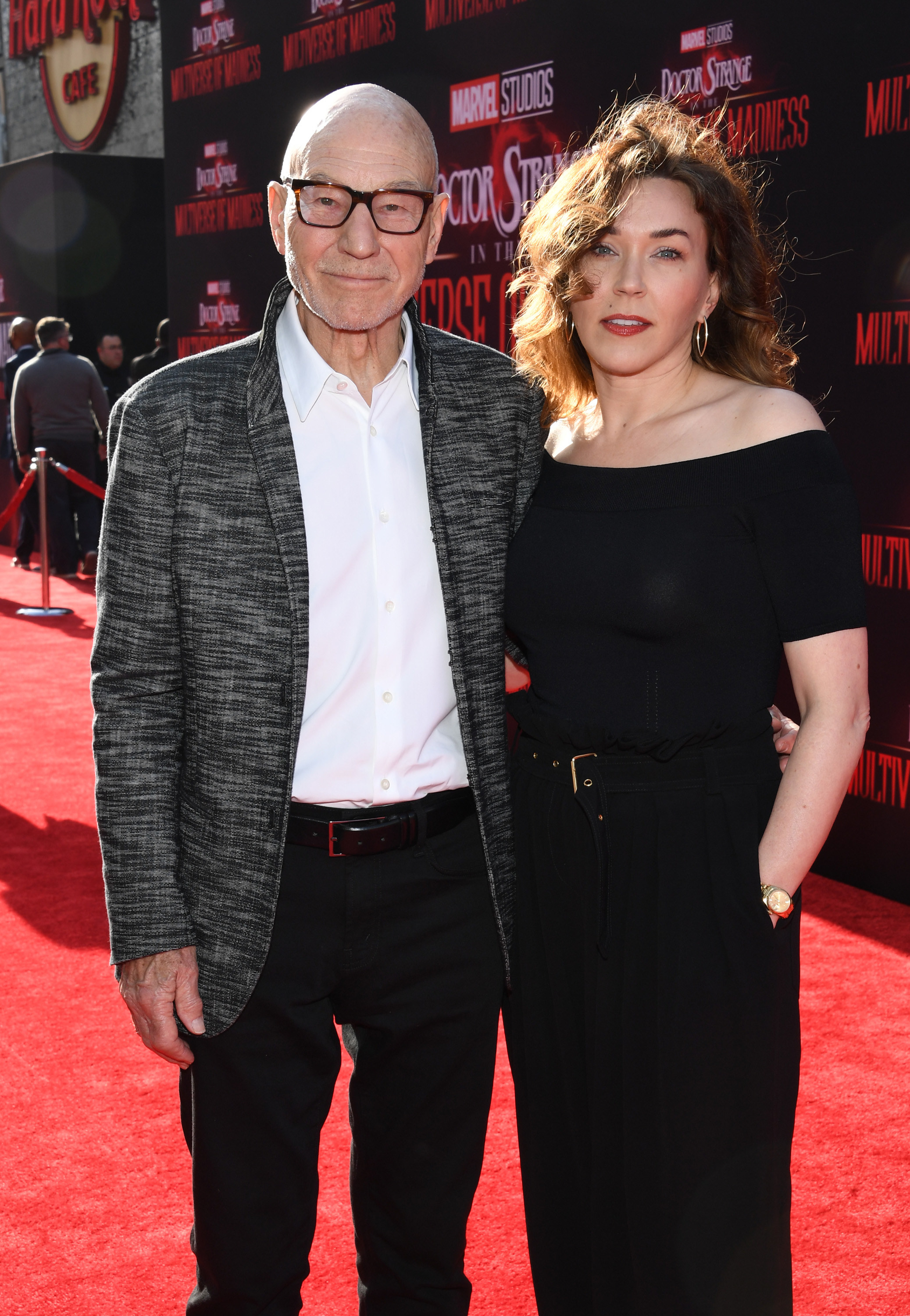 Patrick Stewart and Sunny Ozell stand together on the red carpet