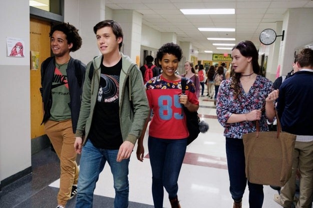 four characters walking together down the hall