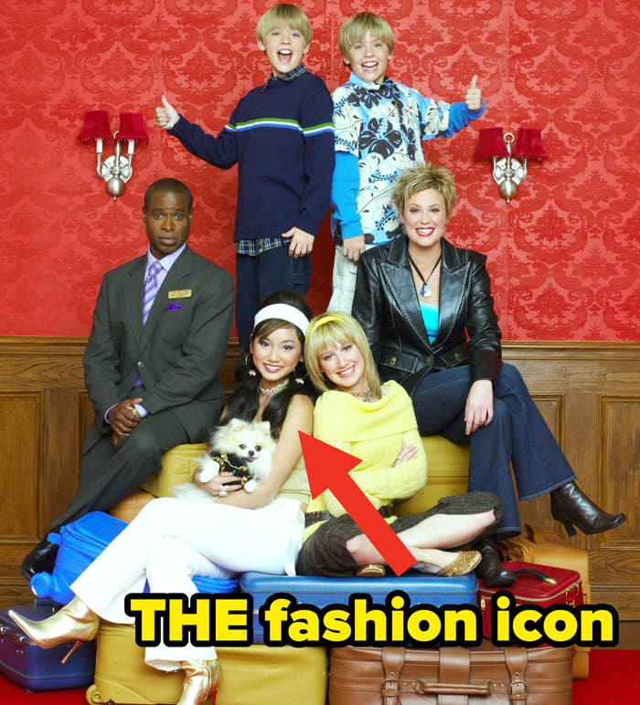 an arrow pointing to Brenda Song in the show promo photo