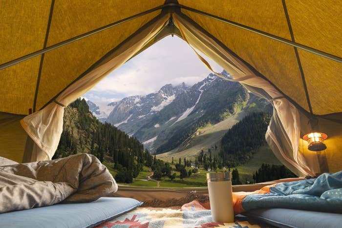 View from inside a tent overlooking a mountain