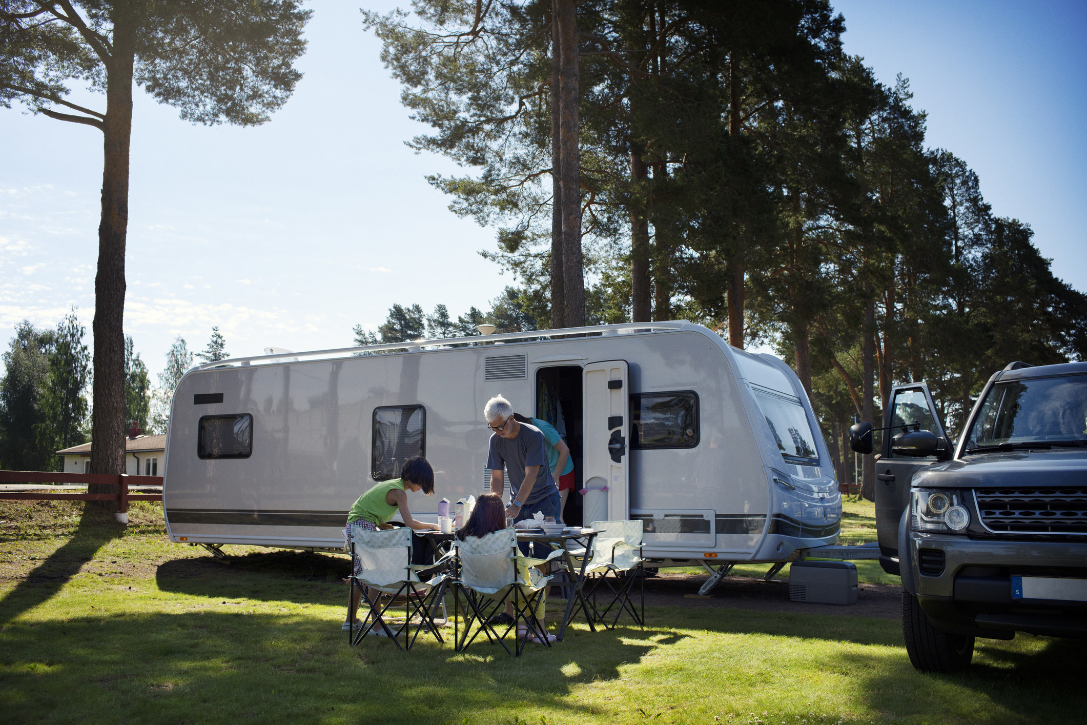 Family eating outside their RV