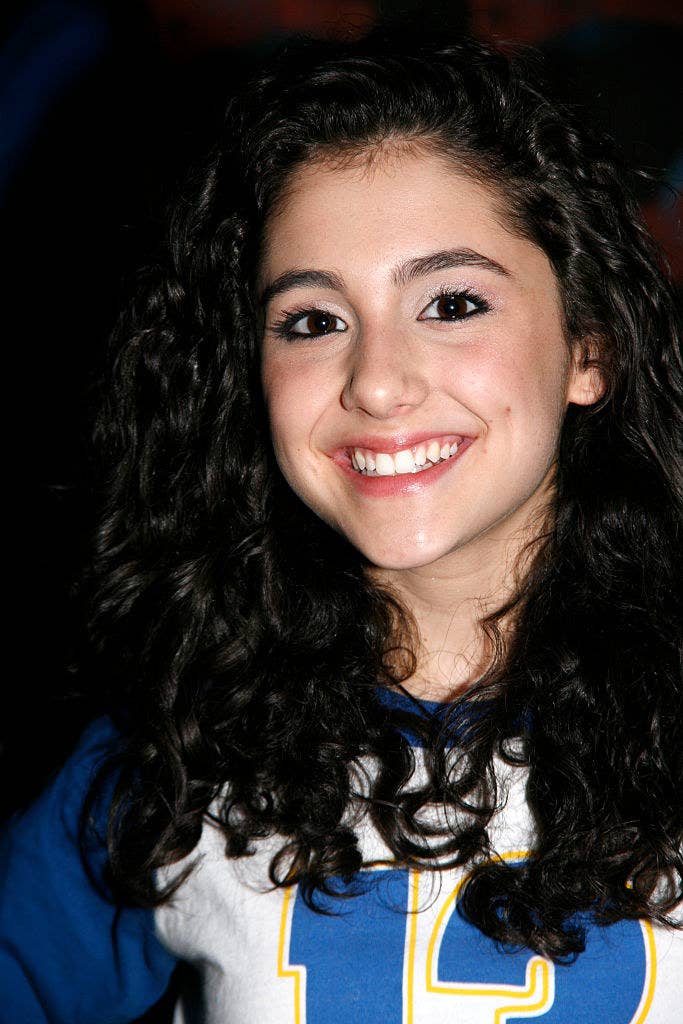 close up of Ariana smiling with loose curly hair