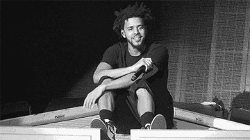 A gif of J. Cole performing during his 2014 Forest Hills Dr. Tour