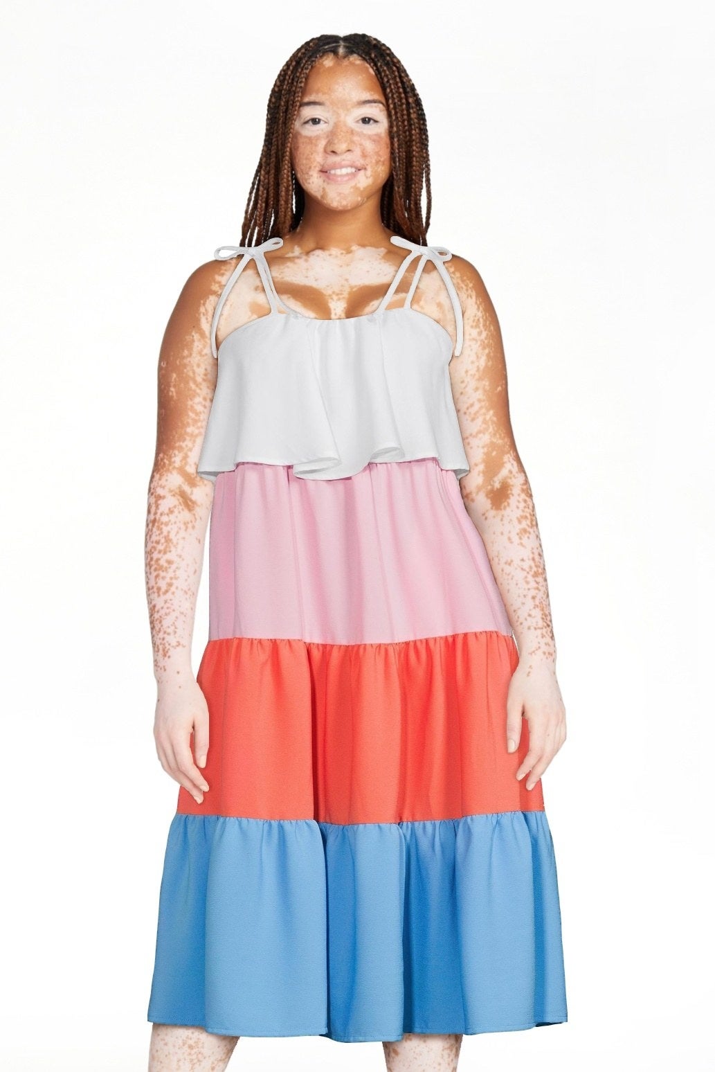 Model wearing the white/pink/orange/blue dress