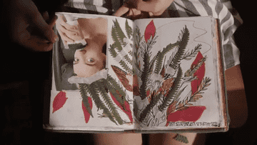 GIF of someone flipping through their journal
