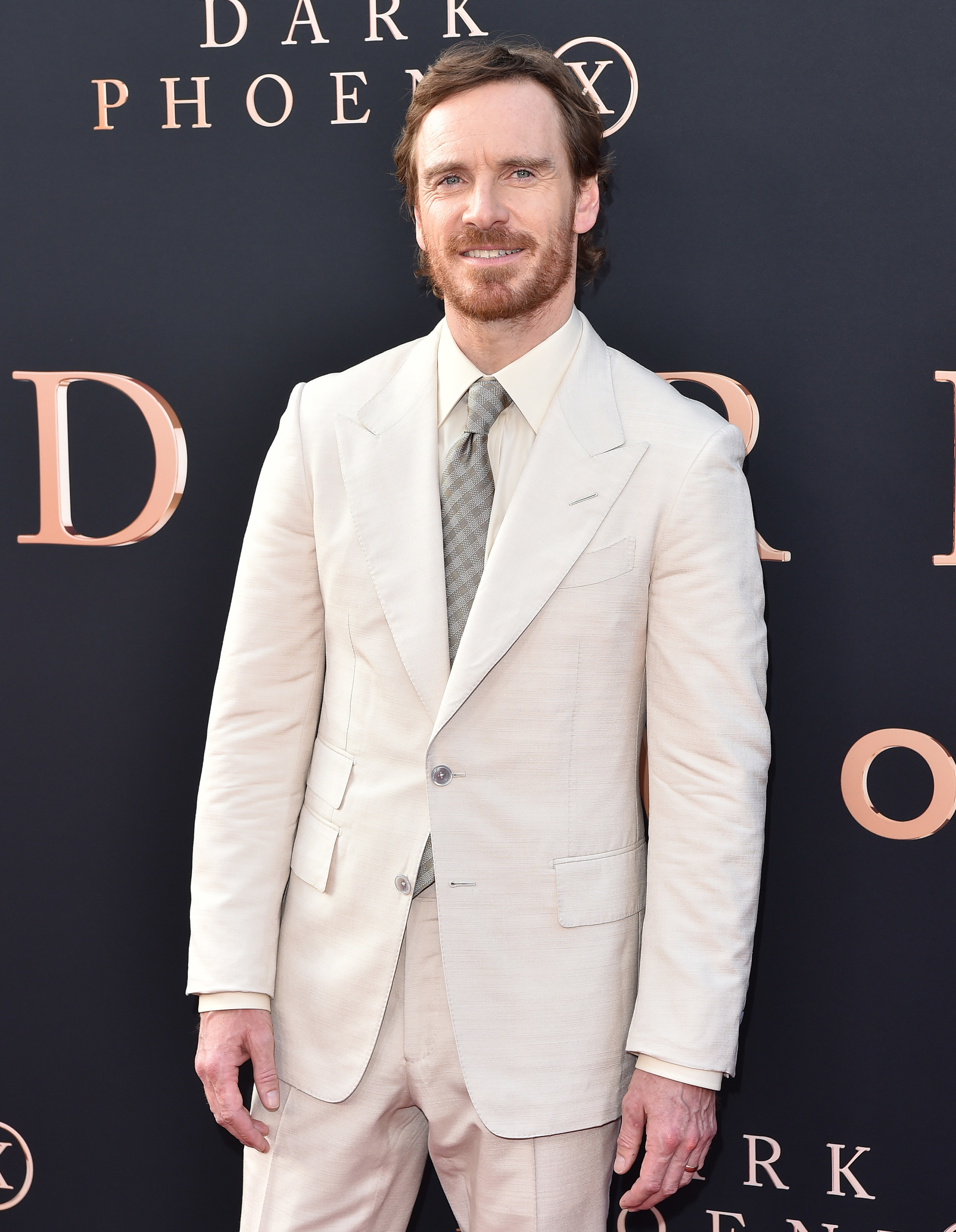 Michael Fassbender in a suit at an event for Dark Phoenix film