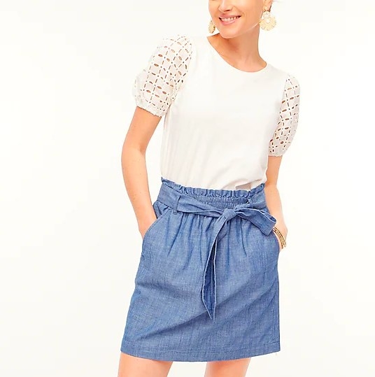 Model wearing chambray skirt and white top