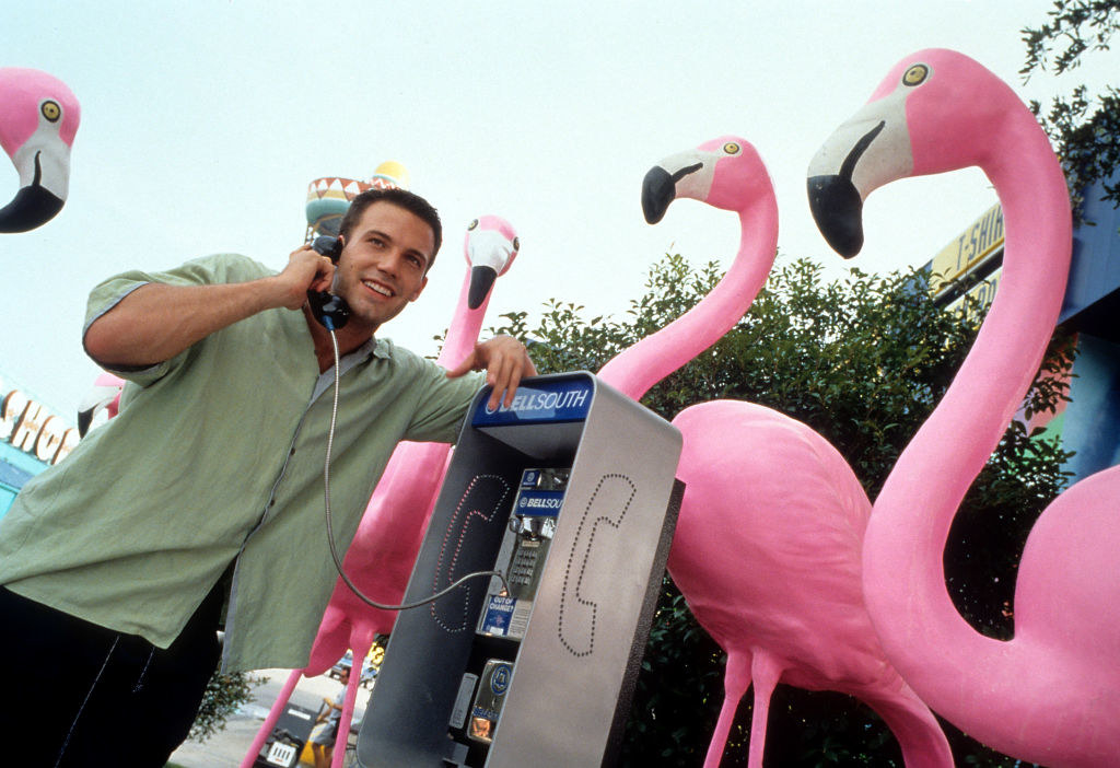 A man using a pay phone.