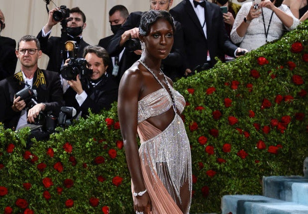 Jodie Turner-Smith poses on the red carpet as photographers take pictures