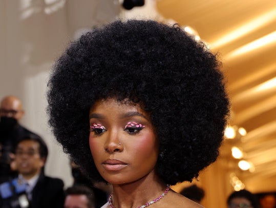 Kiki Layne with hot pink jeweled eyeshadow