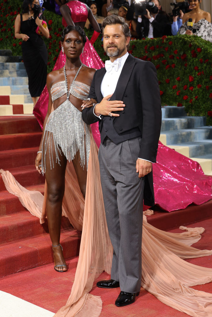 Jodie Turner-Smith and Joshua Jackson link arms on the red carpet