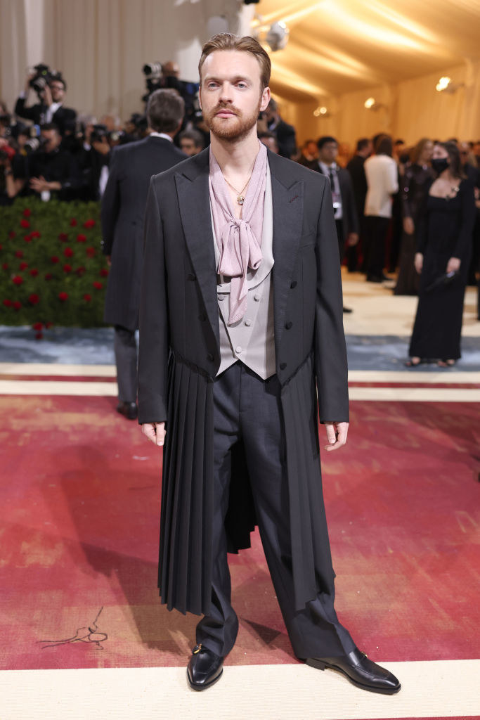 Finneas O&#x27;Connell in a suit with a long, pleated jacket