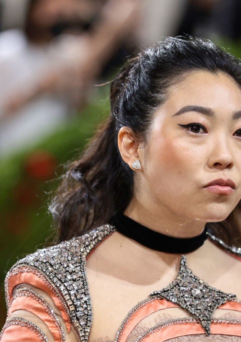 A closeup of Awkwafina that shows the jeweled look of the dress