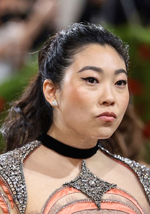 A closeup of Awkwafina that shows the jeweled look of the dress