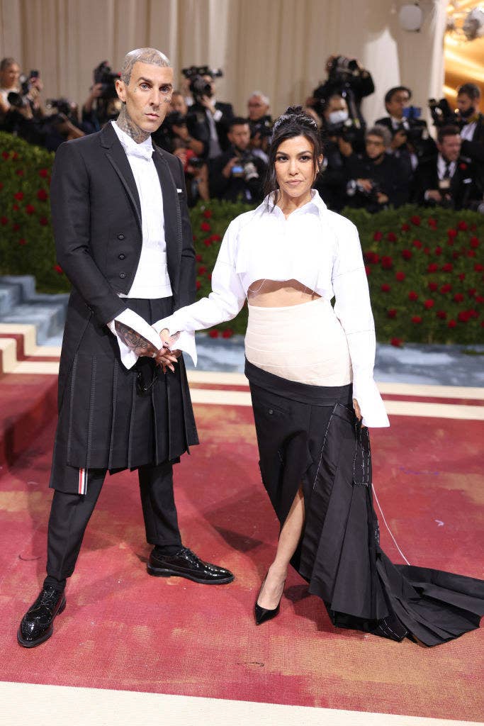 Travis Barker and Kourtney Kardashian hold hands on the red carpet