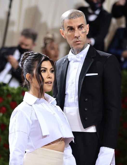 A closeup of Kourtney Kardashian and Travis Barker