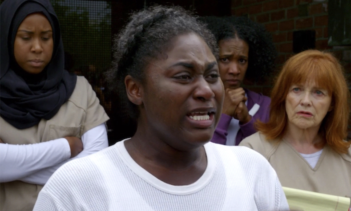 Taystee crying as she speaks to the crowd in Orange Is the New Black