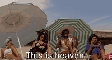 gif of several women at the beach. one saying this is heaven.