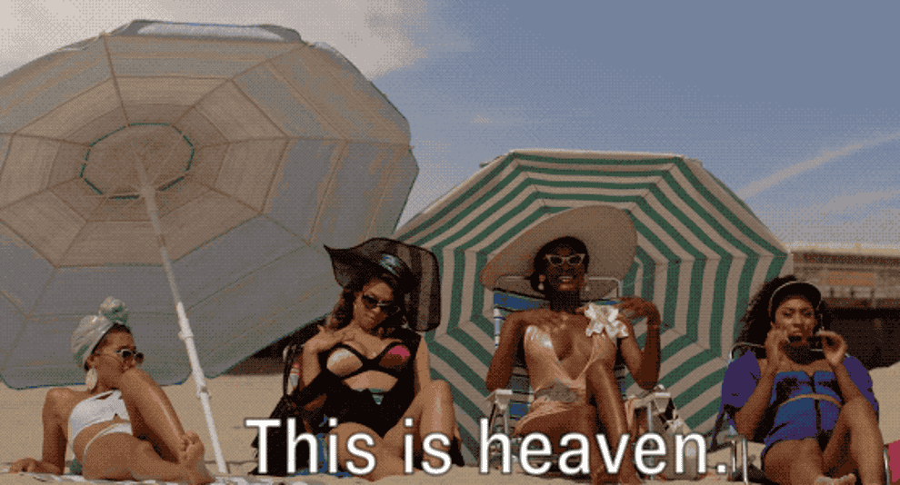 gif of several women at the beach. one saying this is heaven.