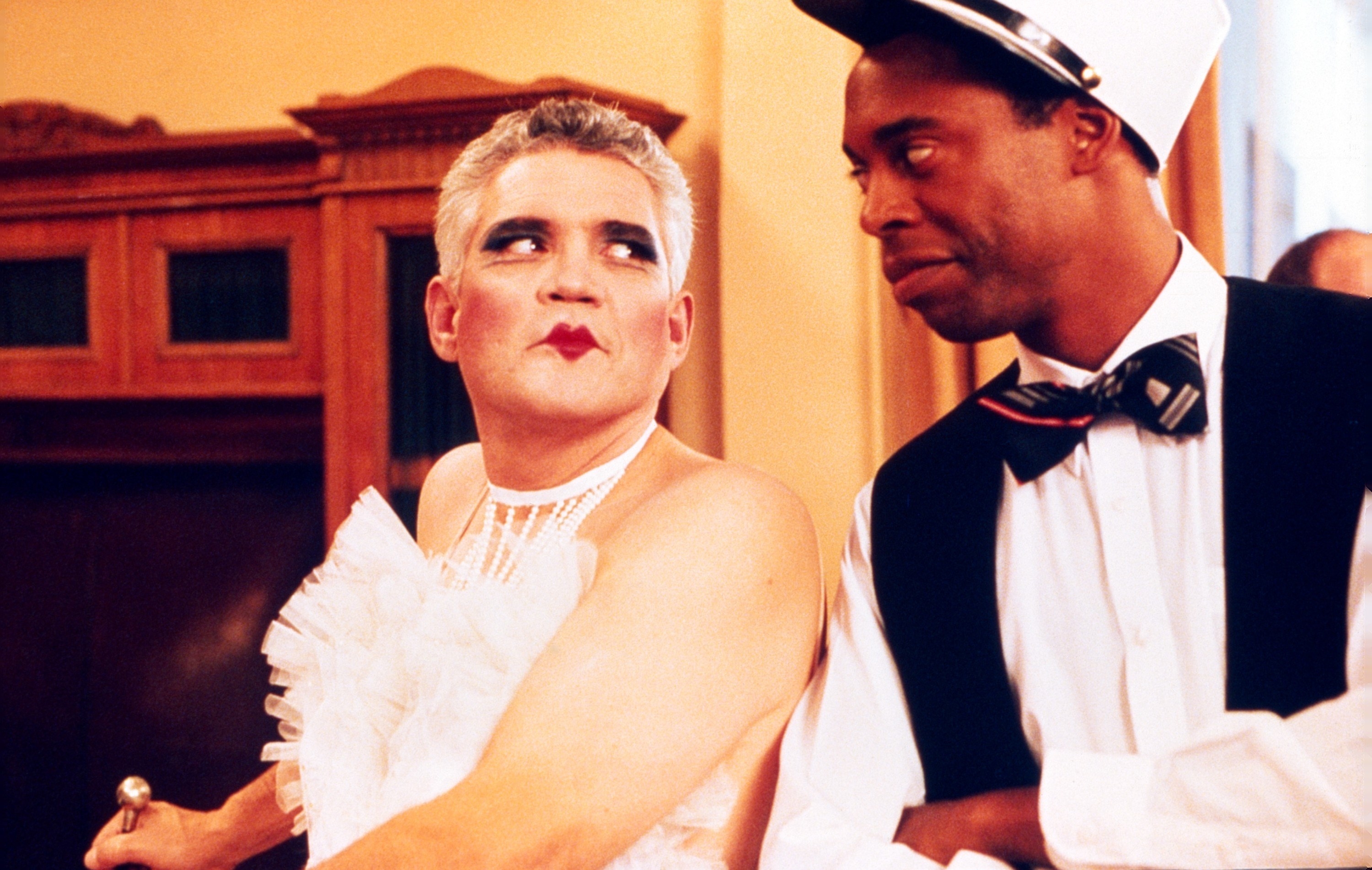 man in drag with another man in the film