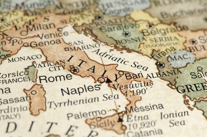 A close-up/macro photograph of Italy from a desktop globe.