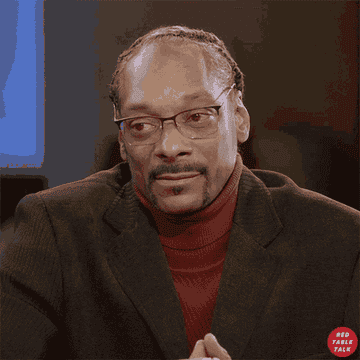 Snoop Dogg shaking his head.