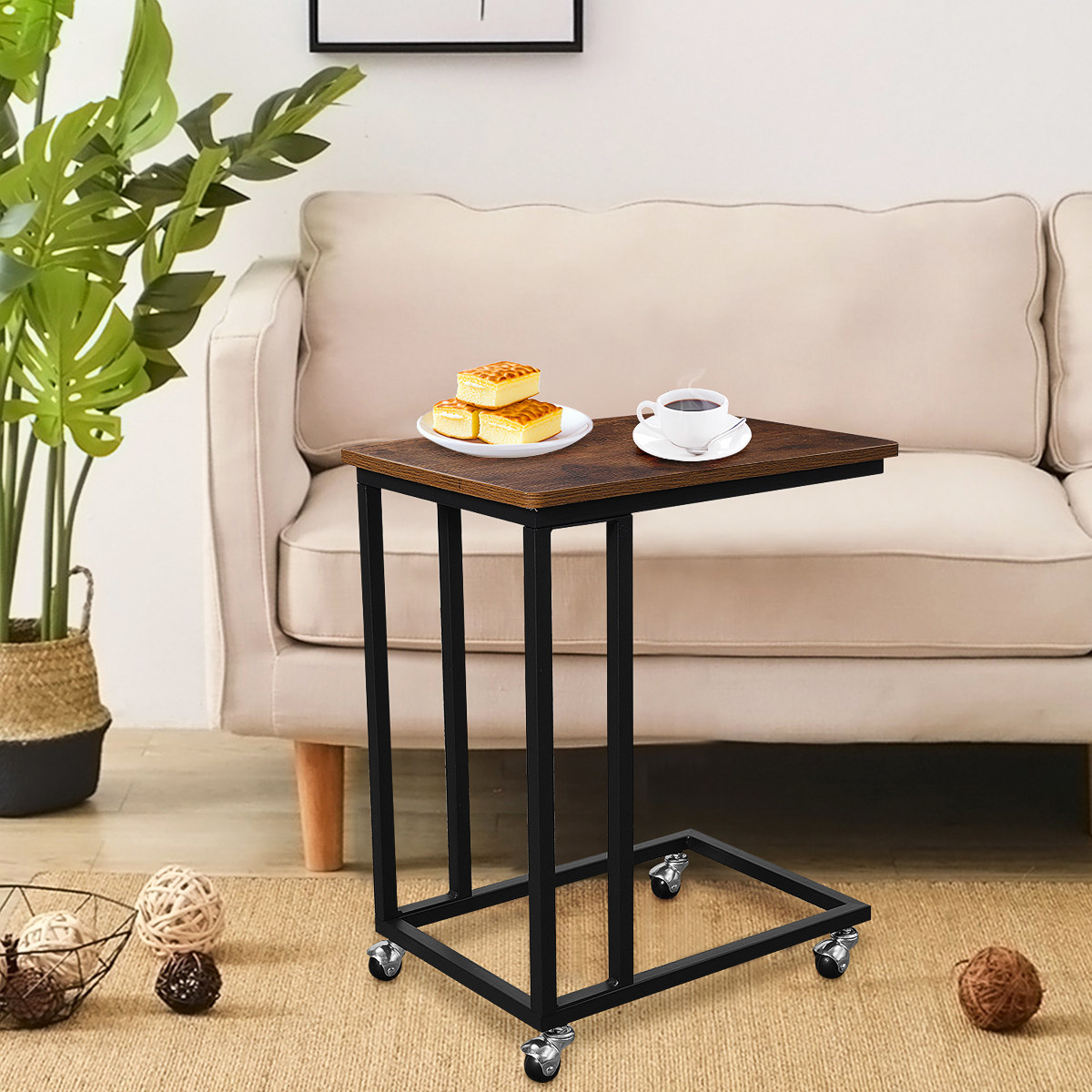 An image of a C-shaped side sofa table with four wheels