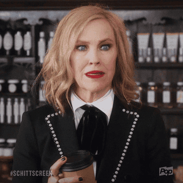 a gif of moira rose saying&quot; there&#x27;s nothing wrong with treating yourself, dear&quot;