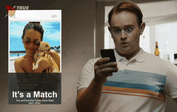 man gets a match on a dating app and cheers