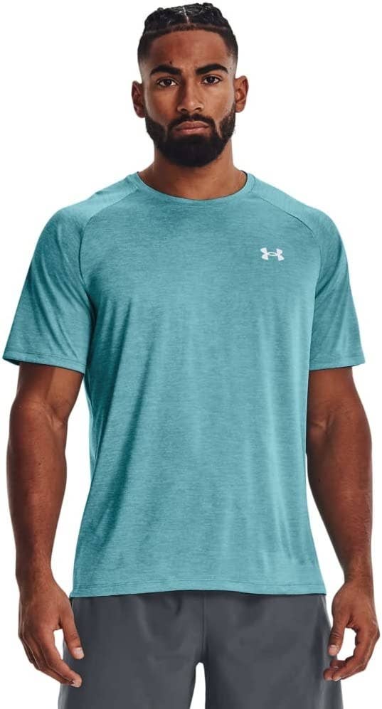 model in teal tee with small under armour symbol