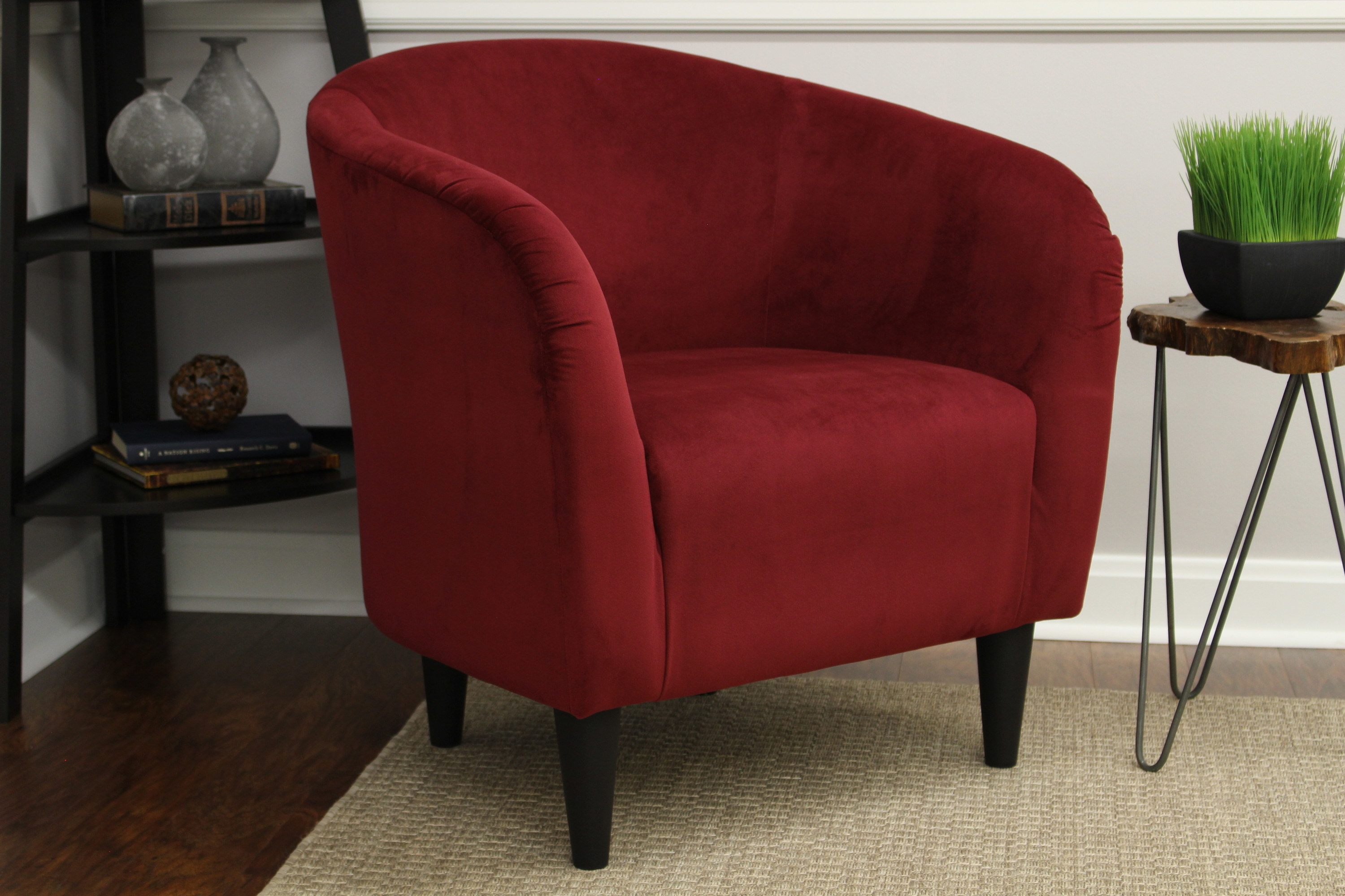 An image of a berry red microfiber tub accent chair with a padded seat cushion and screw in legs