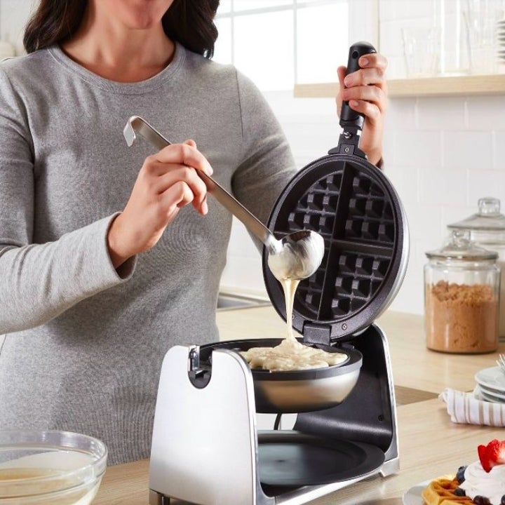Model pouring batter into waffle maker