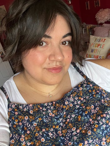 Bianca taking a selfie while wearing the black honey lipstick