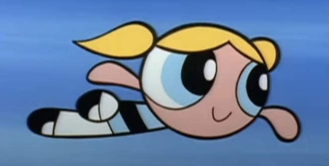 Bubbles cheerfully flying in the air before she punches a villain
