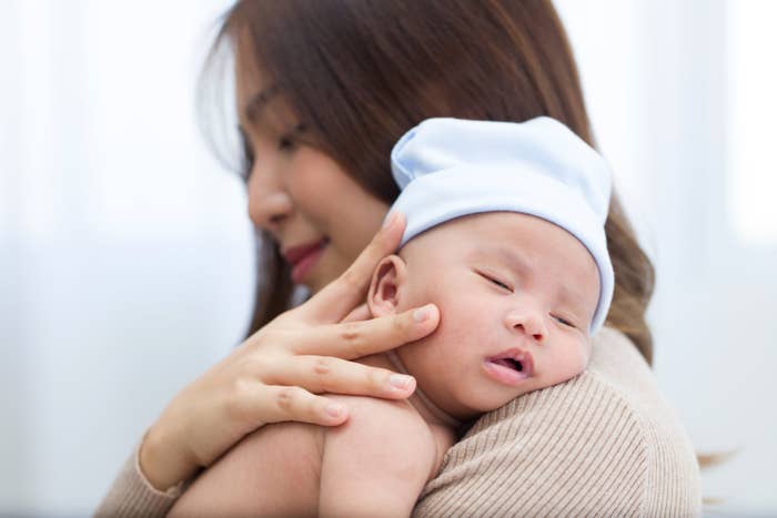 Young mom holding a newborn baby