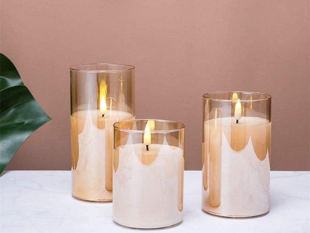 a trio of flameless candles in glass votives
