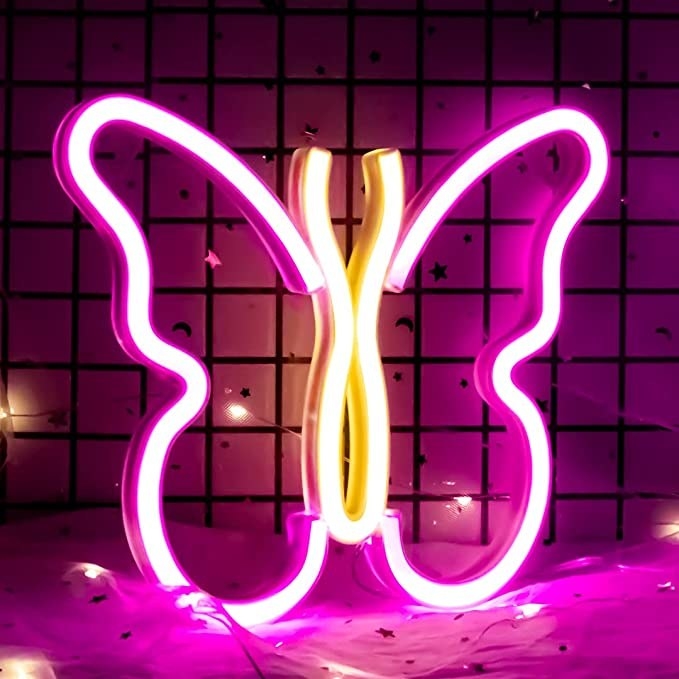 The butterfly-shaped lamp lit up in a room