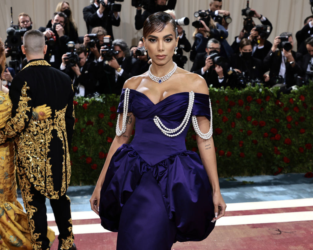 Anitta posing in the pearl-adorned, off the shoulder dress
