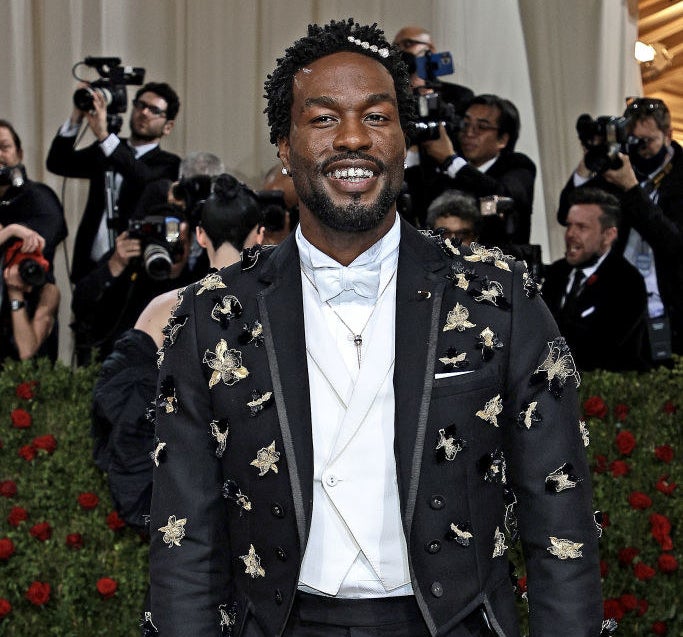 Yahya Abdul-Mateen II smiling on the red carpet