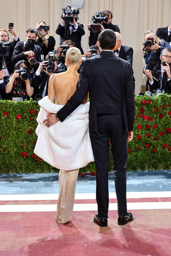 Kim Kardashian and Pete Davidson standing together and facing the paparazzi